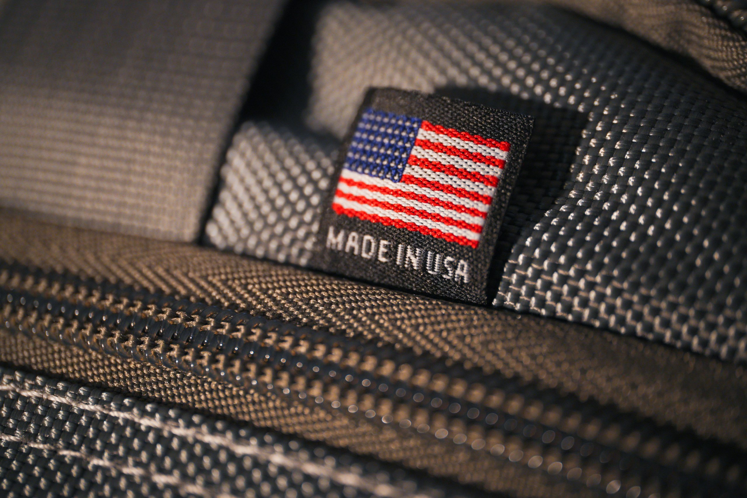 Close-up of a woven Made in USA flag tag